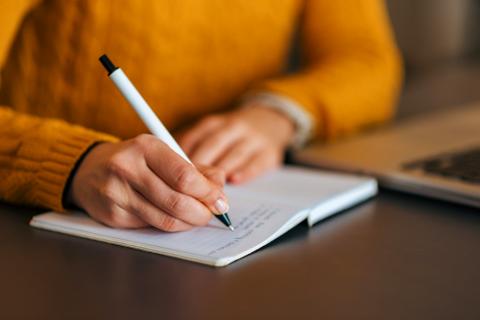 Writing in notebook